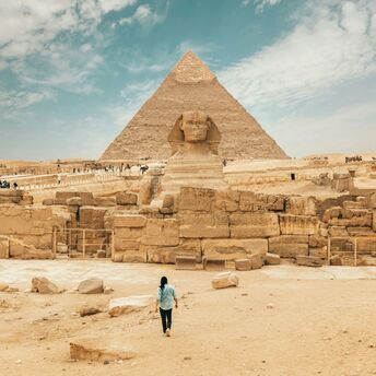Person walking near the great sphinx