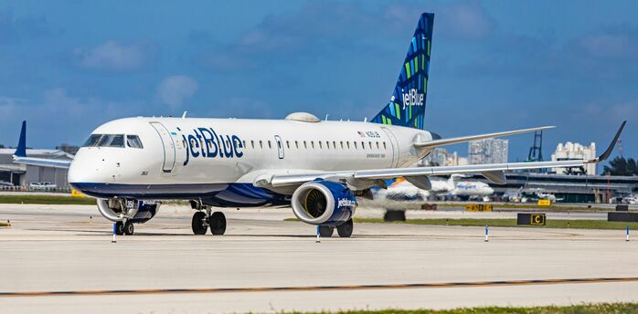 JetBlue Embraer 190 aircraft on the runway, ready for departure