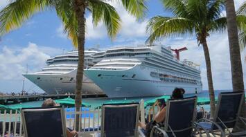 Carnival Legend and Carnival Sunshine Against Tropical Coastline