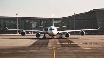Passenger airplane on the runway at an airport
