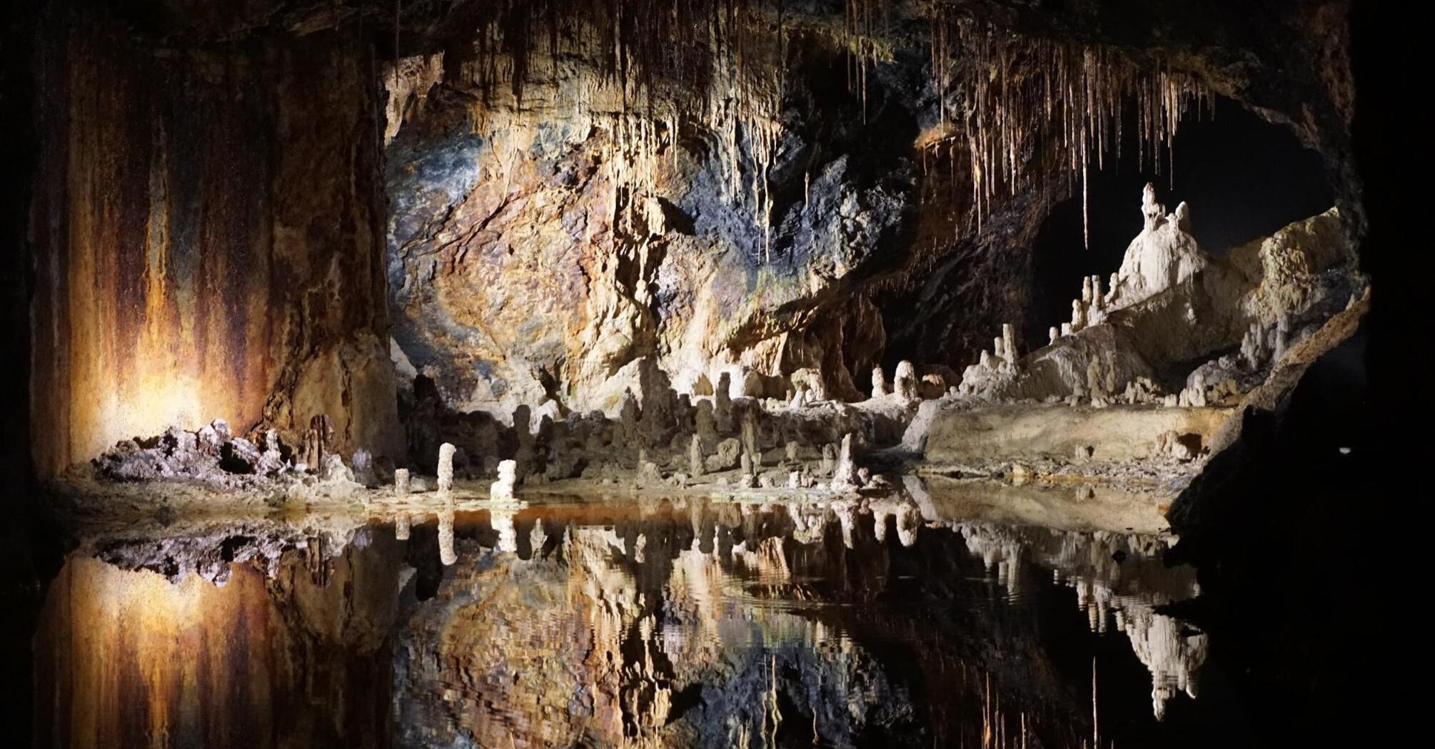 Cave reflections in still water