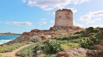 An ancient tower on the Sardinian coast, perched above the rocks and sea