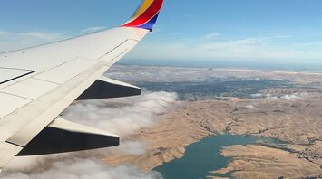 View from an airplane window over a landscape