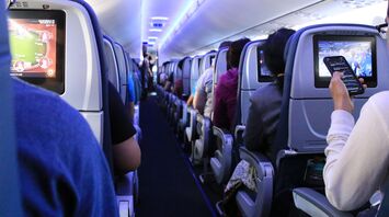 Passengers seated inside an airplane cabin
