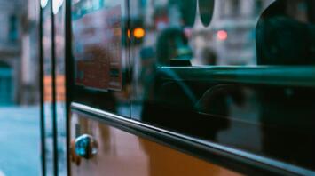Close-up view of a city bus at a bus stop