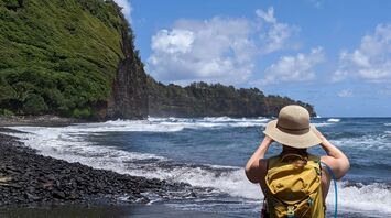 a person in a hat on a beach