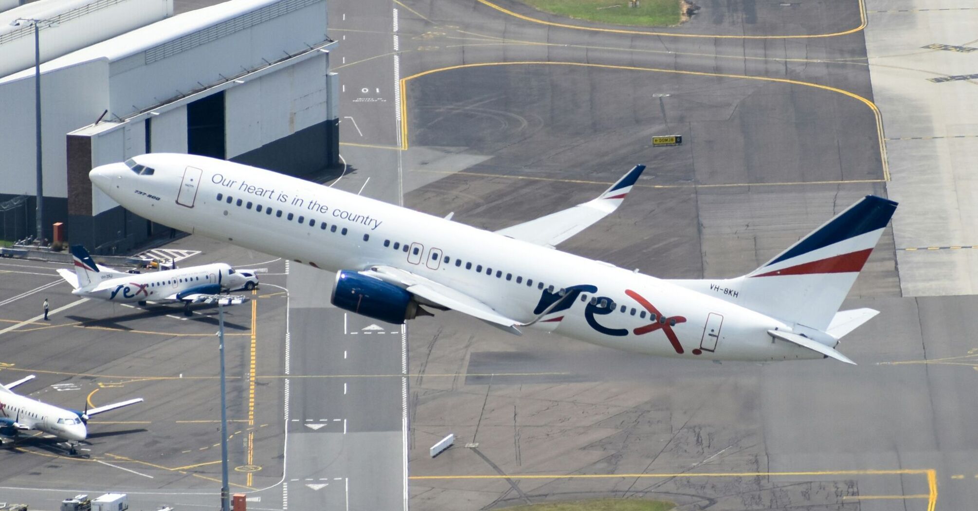 Rex 737-800 departing Sydney Airport