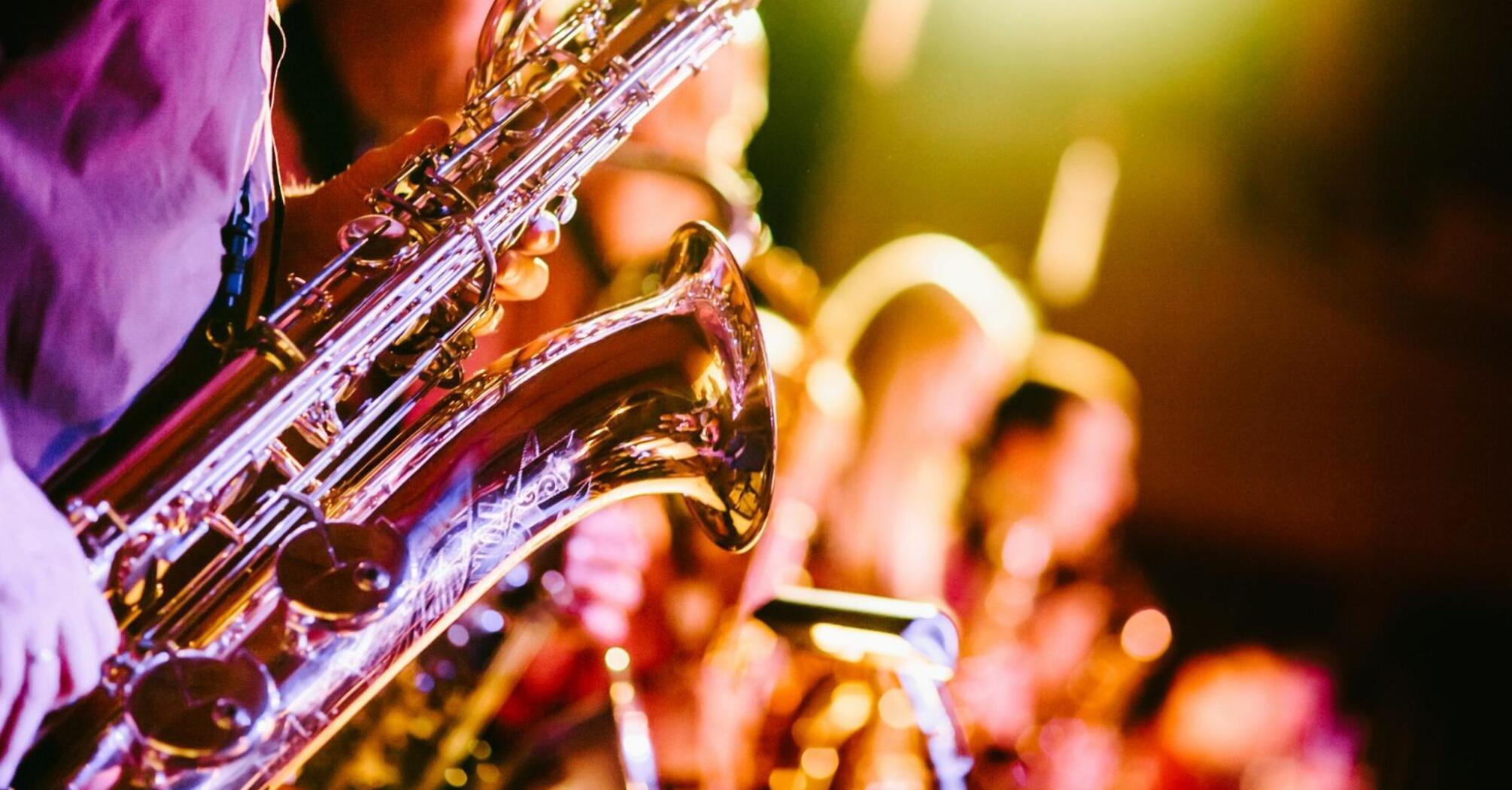 Close-up of saxophonists playing during a live jazz performance