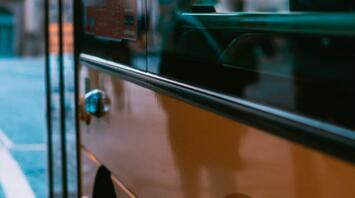 Close-up view of a bus parked on a city street