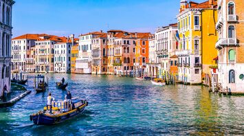 Venice canal with colorful buildings and boats