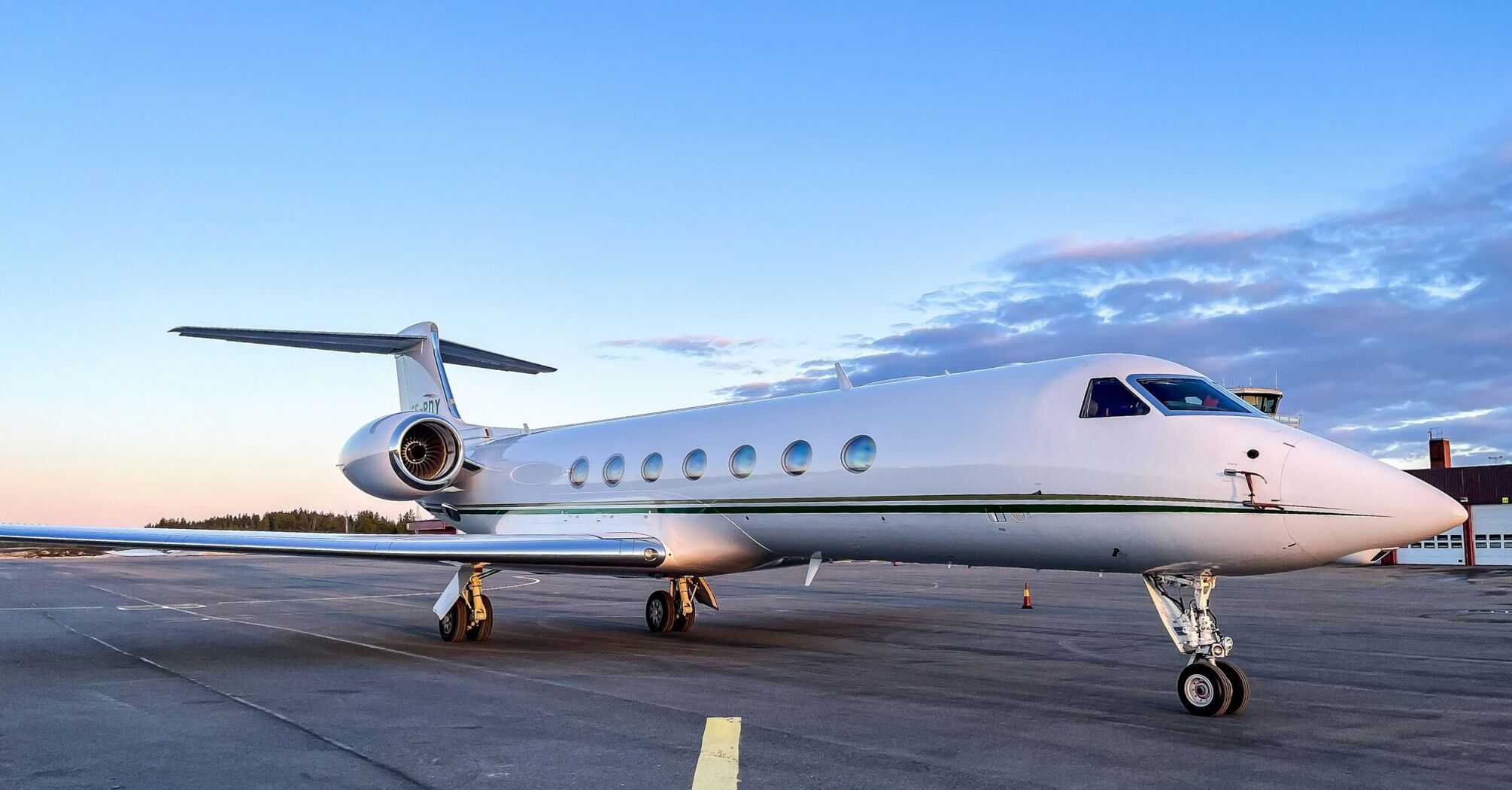 a private jet sitting on the tarmac of an airport