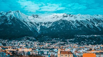View of Innsbruck with snow-capped mountains in the background