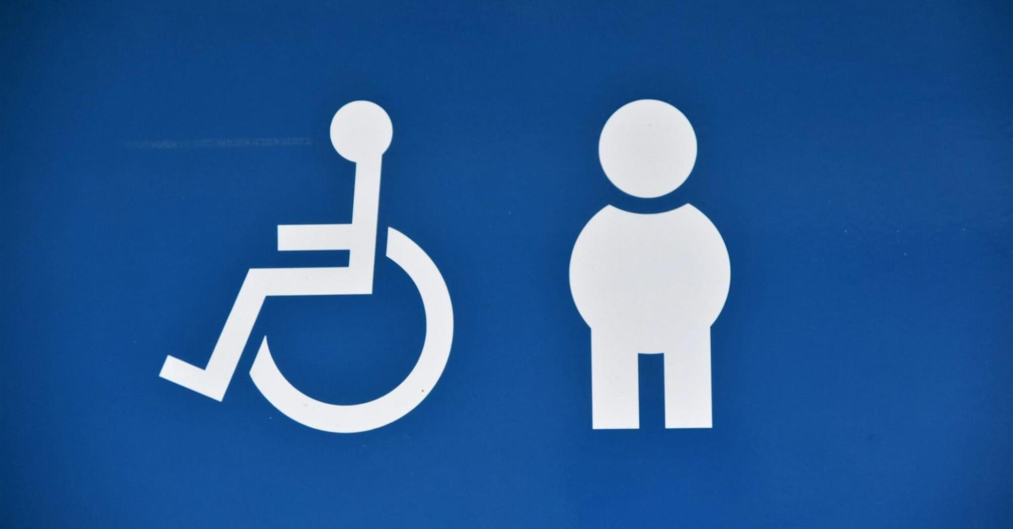 Symbols for disabled and non-disabled access on a blue background