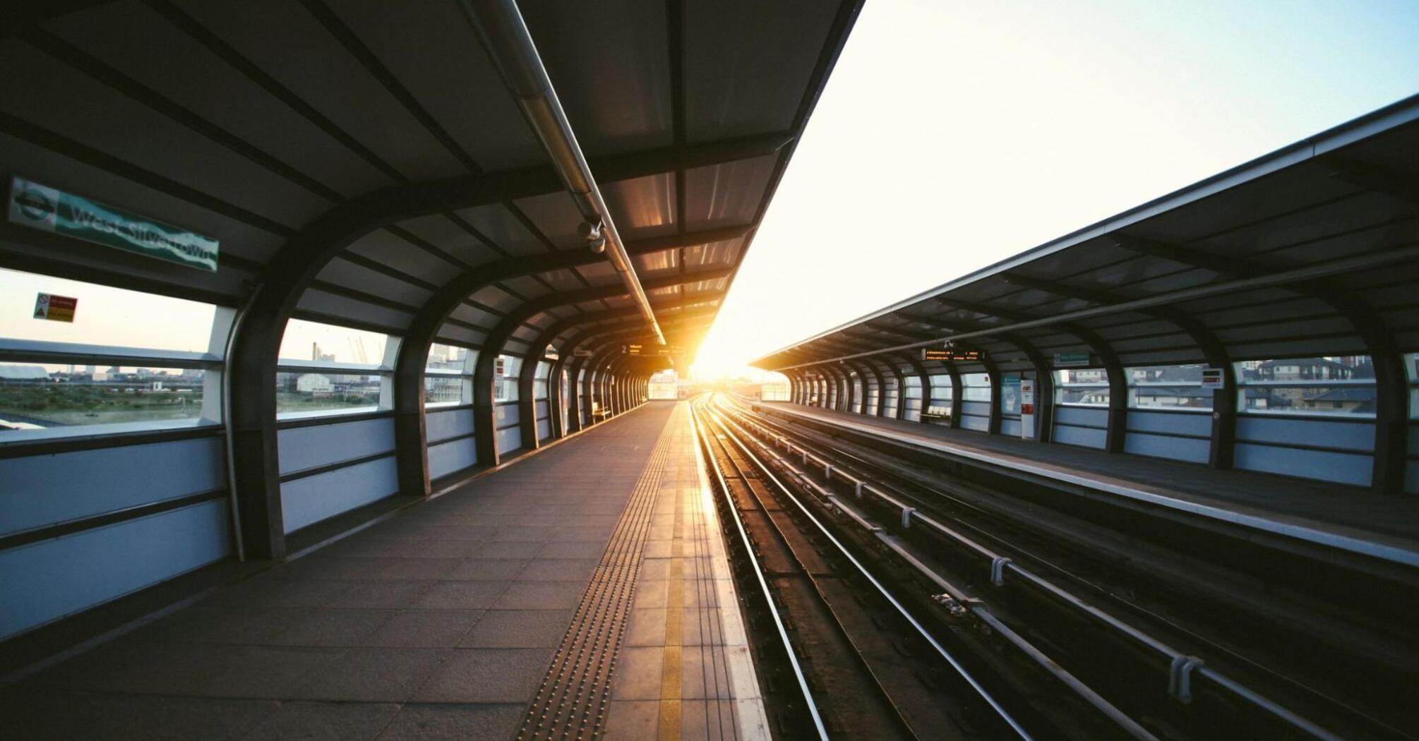 Empty modern train platform at sunrise