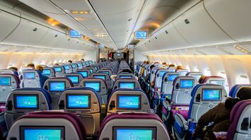 Passengers seated in an airplane cabin