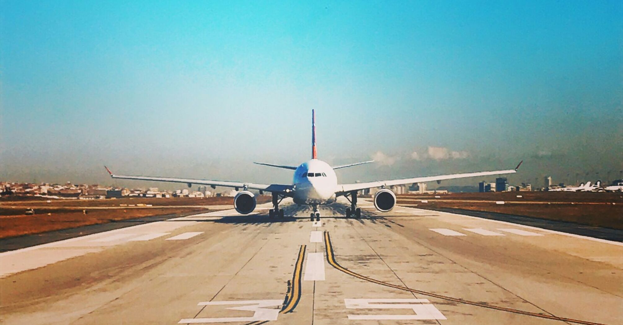 Airplane on runway preparing for takeoff