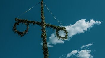 green cross under blue sky