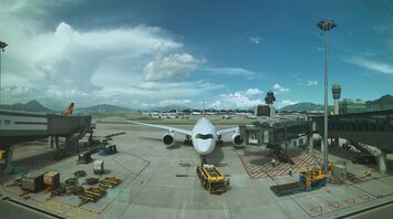 scenery of white airplane landed on Hong Kong airport