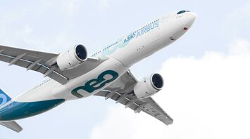 white and blue airplane in the sky