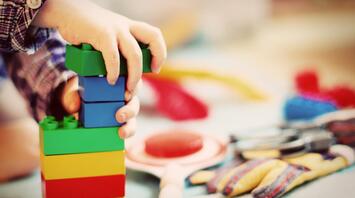 Child plays with a children's construction set