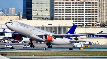 SAS airplane taking off from an airport