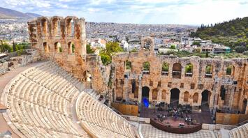 View of the ancient amphitheater with the modern city in the background