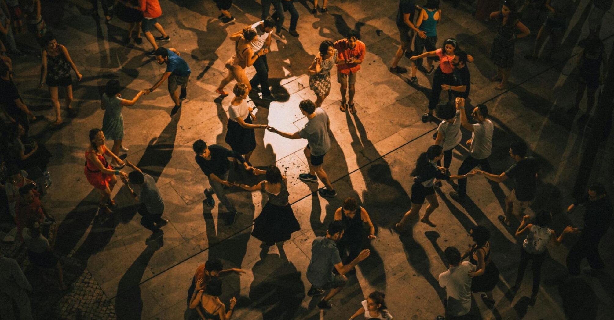 People dancing on the street in the night