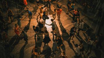 People dancing on the street in the night