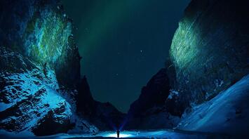 Auroras bursting down the canyon at midnight
