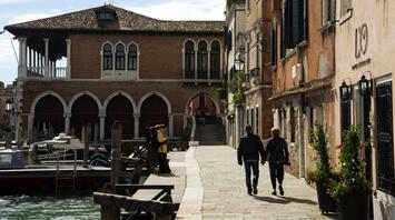 Walking couple on the street of Vinice, Italy