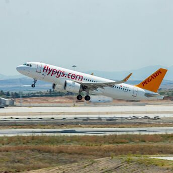 a large jetliner taking off from an airport runway