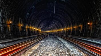 Railway tunnel with underground tracks and engineering communications