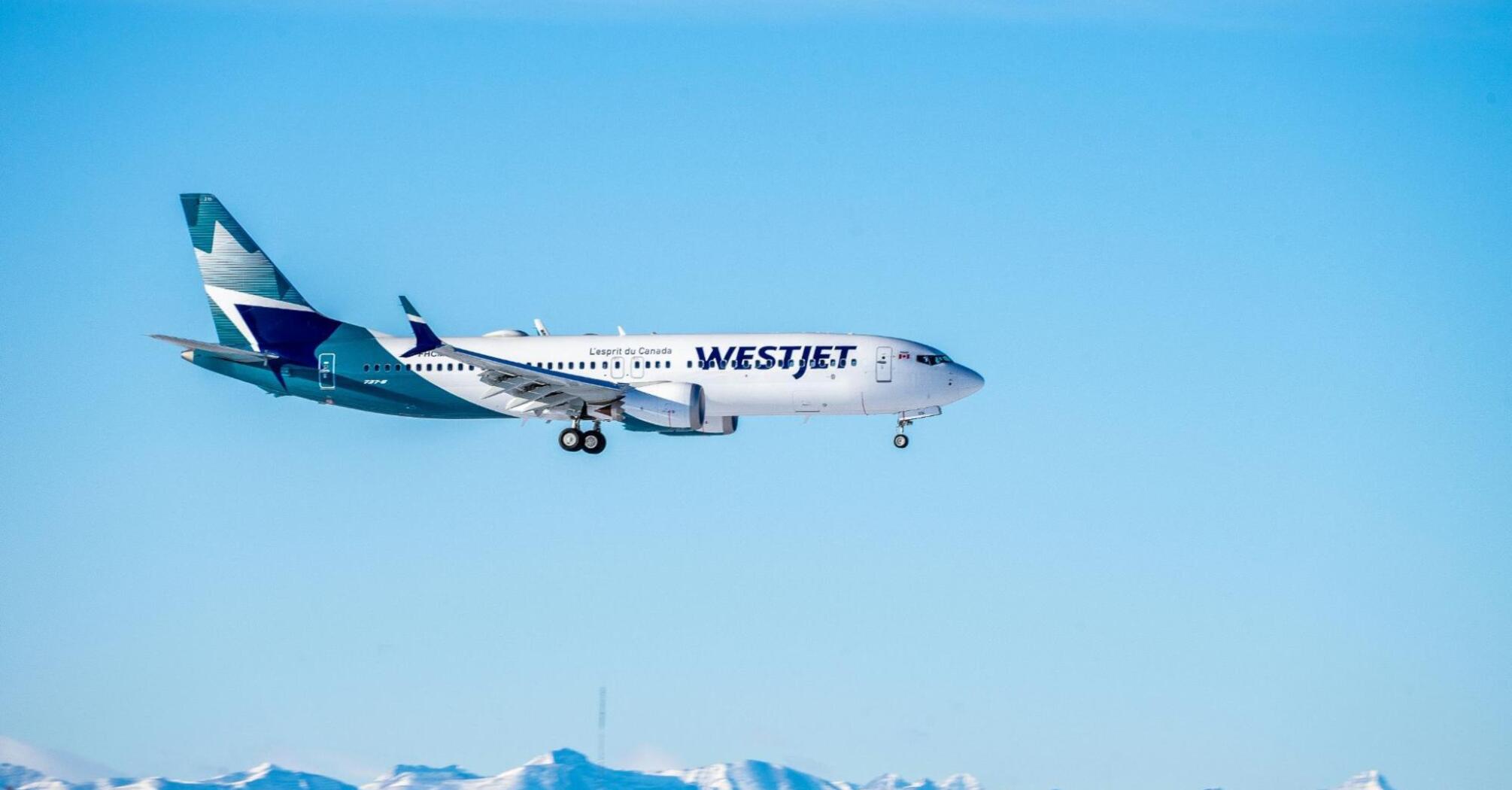 WestJet plane flying in the sky