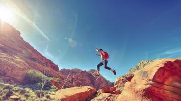 The guy jumping in the mountains