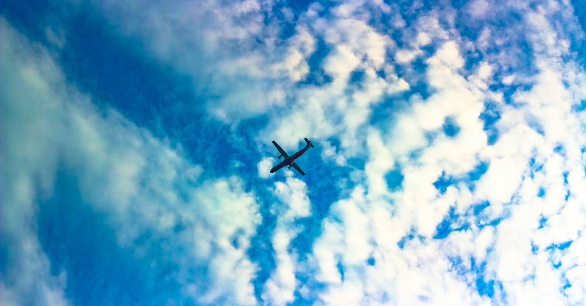 Airplane flying amidst clouds