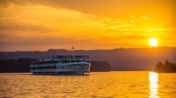 Ship against the backdrop of a golden sunset