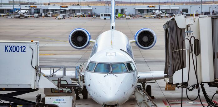 a large jetliner sitting on top of an airport tarmac