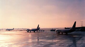 Airplanes on the runway at sunrise