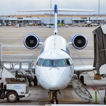 a large jetliner sitting on top of an airport tarmac