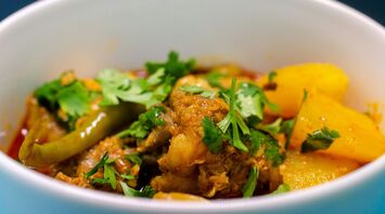 a close up of a bowl of food on a table