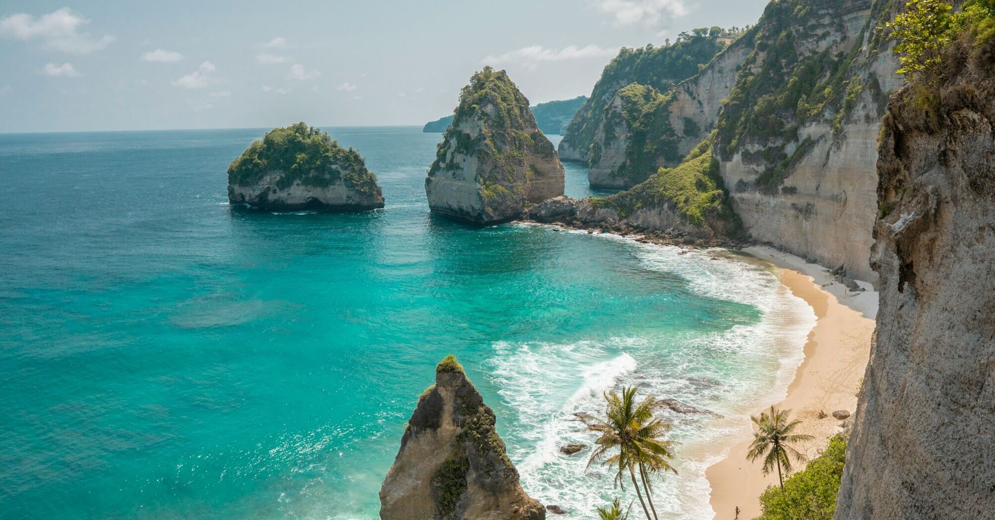Stunning coastal view of Bali with clear turquoise water and rocky cliffs