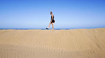 Walking on the edge, Maspalomas, Gran Canaria, Spain