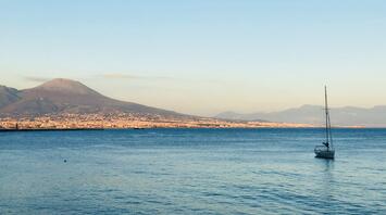Boat on the sea in front of Vesuvius
