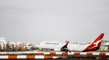 white and red airplane on airport during daytime
