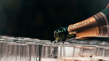 Pouring champagne into glasses
