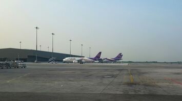 Thai Airways planes on an airport runway