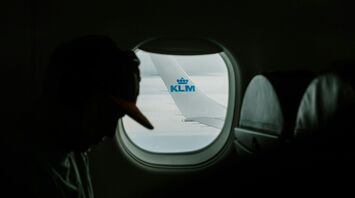 Passenger on a KLM flight with a view of the plane's wing through the window