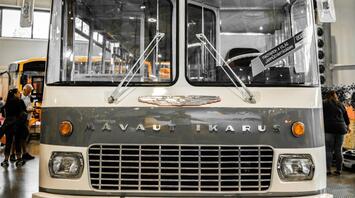 Vintage Volánbusz double-decker bus on display at an indoor transport exhibition