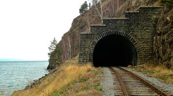 Mountain railway runnel by the lake