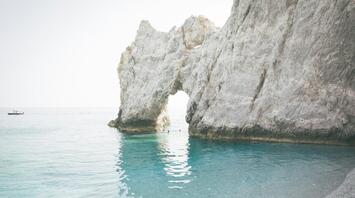 Iconic Lalaria Beach with its unique white pebbles and clear blue waters in Skiathos, Greece